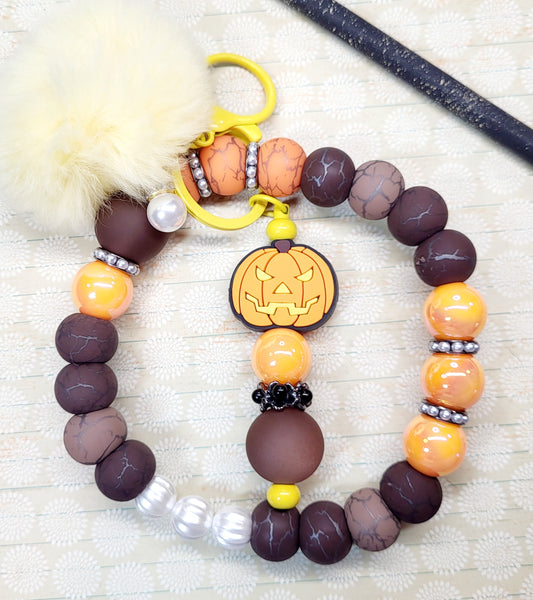 Halloween Beaded Wristlet Keychain – Pumpkin Charm, Brown and Orange Beads, Stainless Steel Wire, Fluffy Cream Pom Pom, Fall Keyring